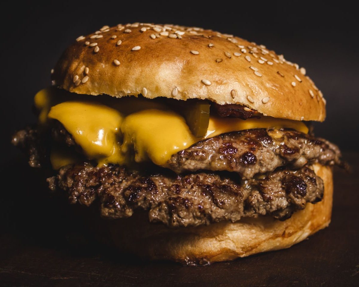 Cheese pull from a cheeseburger
